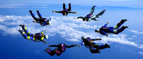 Sportsmen-parashutist soaring in sky